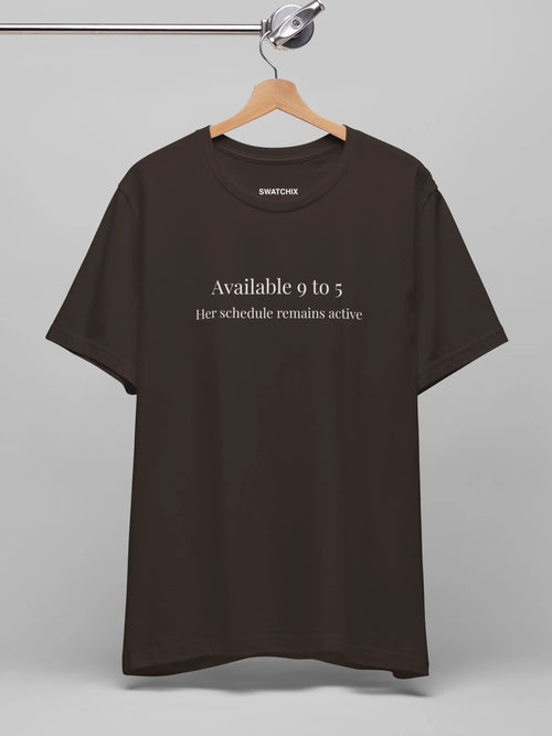 Available 9 to 5 Crewneck Tee in Brown, printed with "Available 9 to 5. Her schedule remains active."