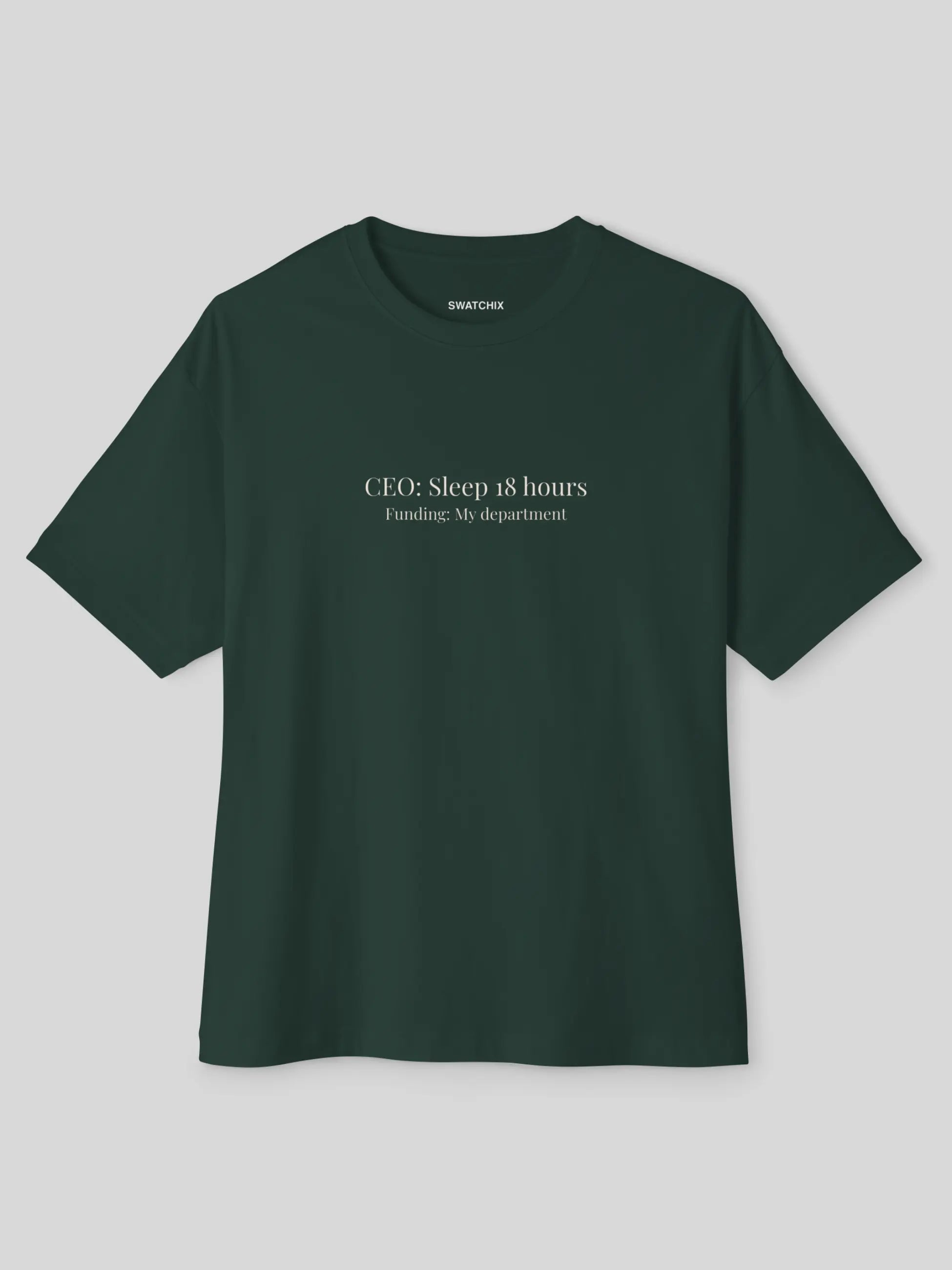 A dark forest green short-sleeve t-shirt with white printed text on the chest reading 'CEO: Sleep 18 hours Funding: My department!' and a small 'SHAPCHU' brand label inside the collar, shown on a neutral gray background.