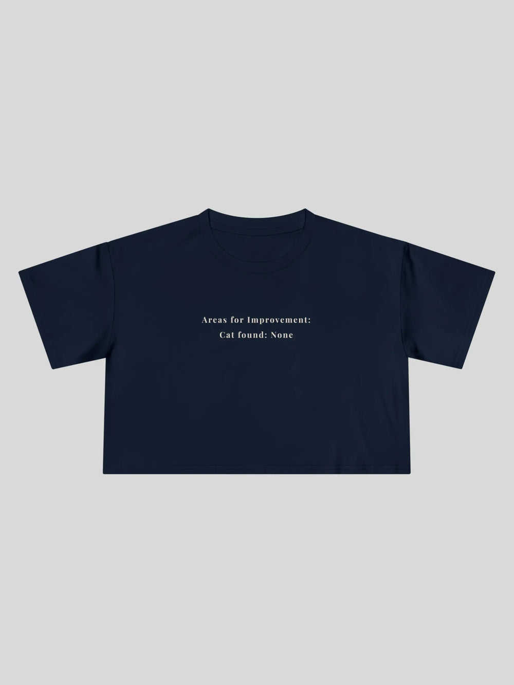 Areas for Improvement Cropped Tee in Navy, printed with "Areas for Improvement: Cat found: None."